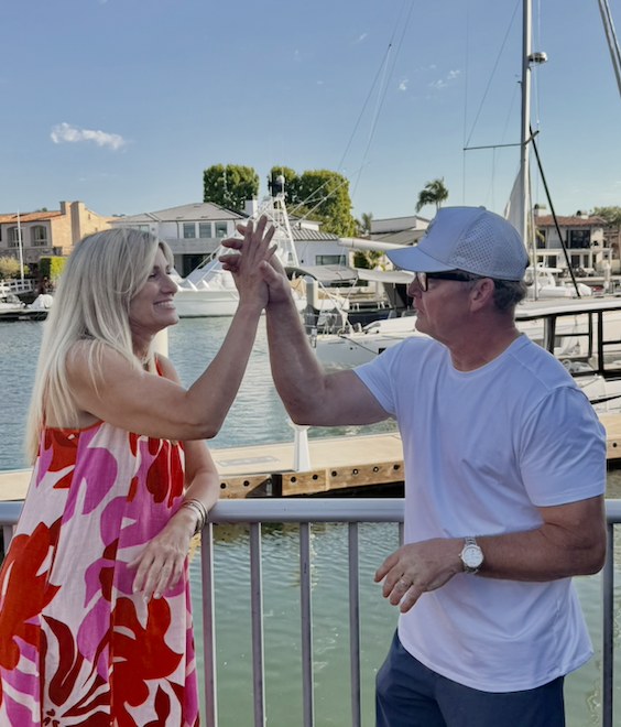 Grace Rogers and Mike O&rsquo;Reilly celebrating at the marina